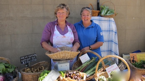 Bronwyn and Helen selling their bountiful produce in "Dojo Lane"